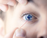 7506(6PR): ERG-Jet Contact Lens Electrodes (6 Pairs) Close up of doctor using ERG Jet electrode on patient's eye
