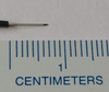 SUBXS:  Extra Small (7mm) Subdermal Needles (24) Needle electrode next to ruler to show 0.7 cm needle length