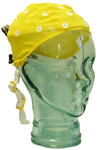 Small yellow EEG cap on glass head